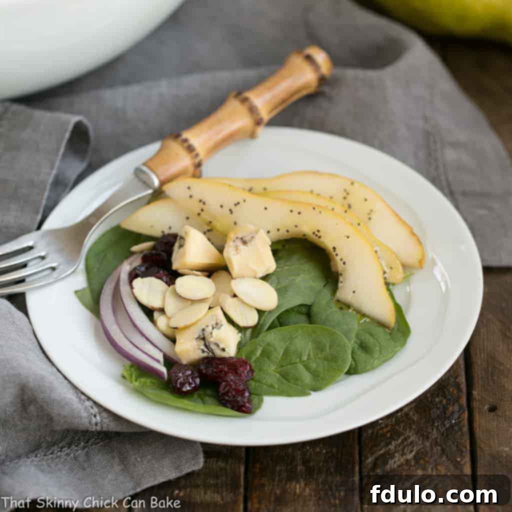 Jeweled Pear and Blue Cheese Spinach Salad 1 featured 49234