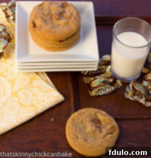 A delightful stack of Milky Way Cookies on white serving plates, with candy wrappers and a glass of milk nearby.