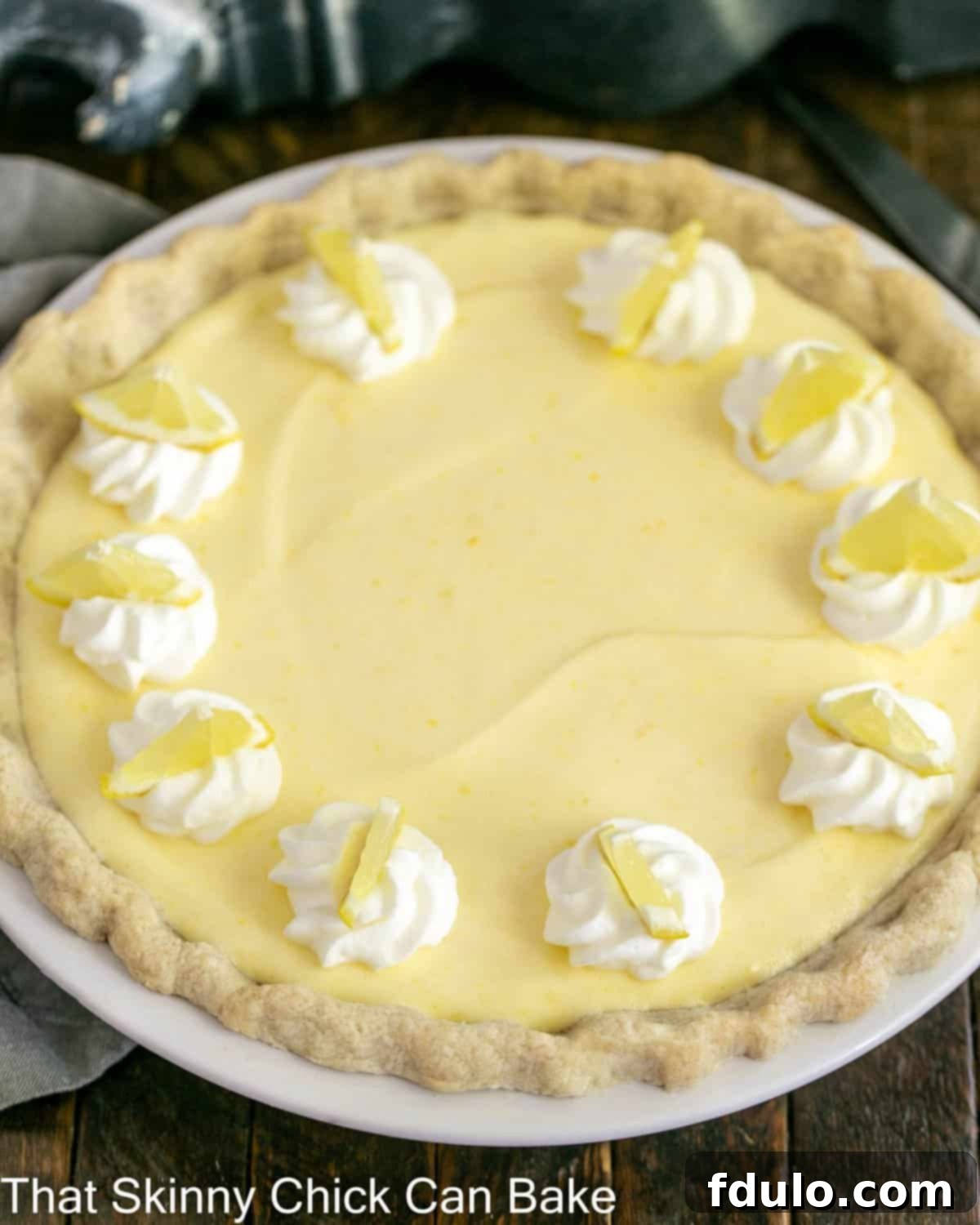 Lemon chiffon pie in a white pie plate from above.