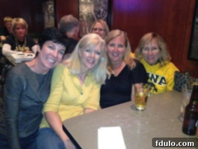 A group of sorority sisters at a bar, enjoying each other's company, implying they are 'taste testers' for the pumpkin roll recipe.