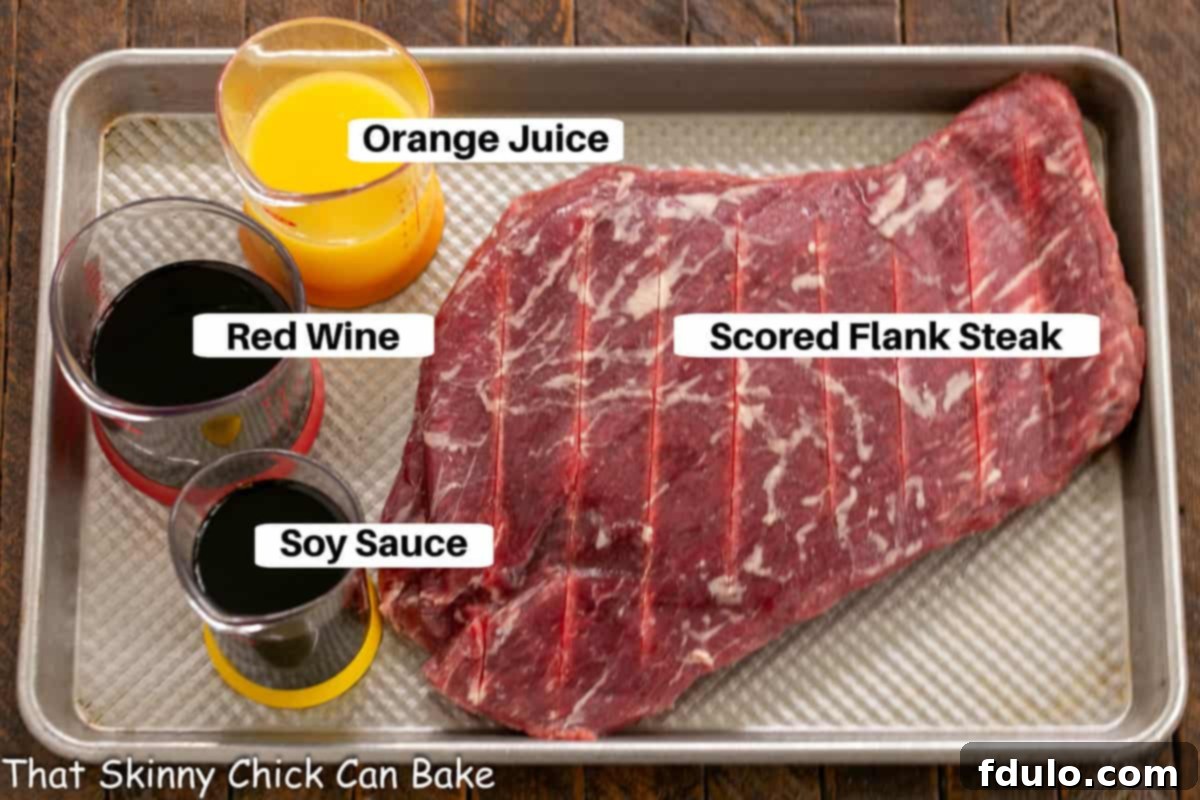 Flank Steak Marinade Ingredients laid out on a sheet pan with labels, ready for mixing.