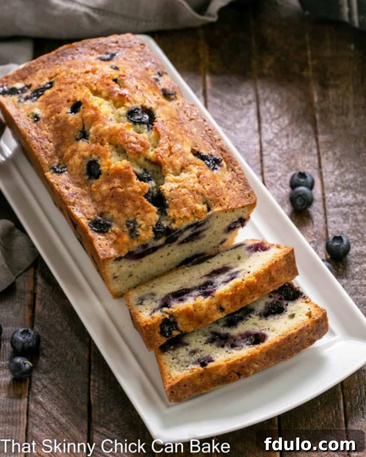Overhead view of sliced blueberry poppy seed bread.