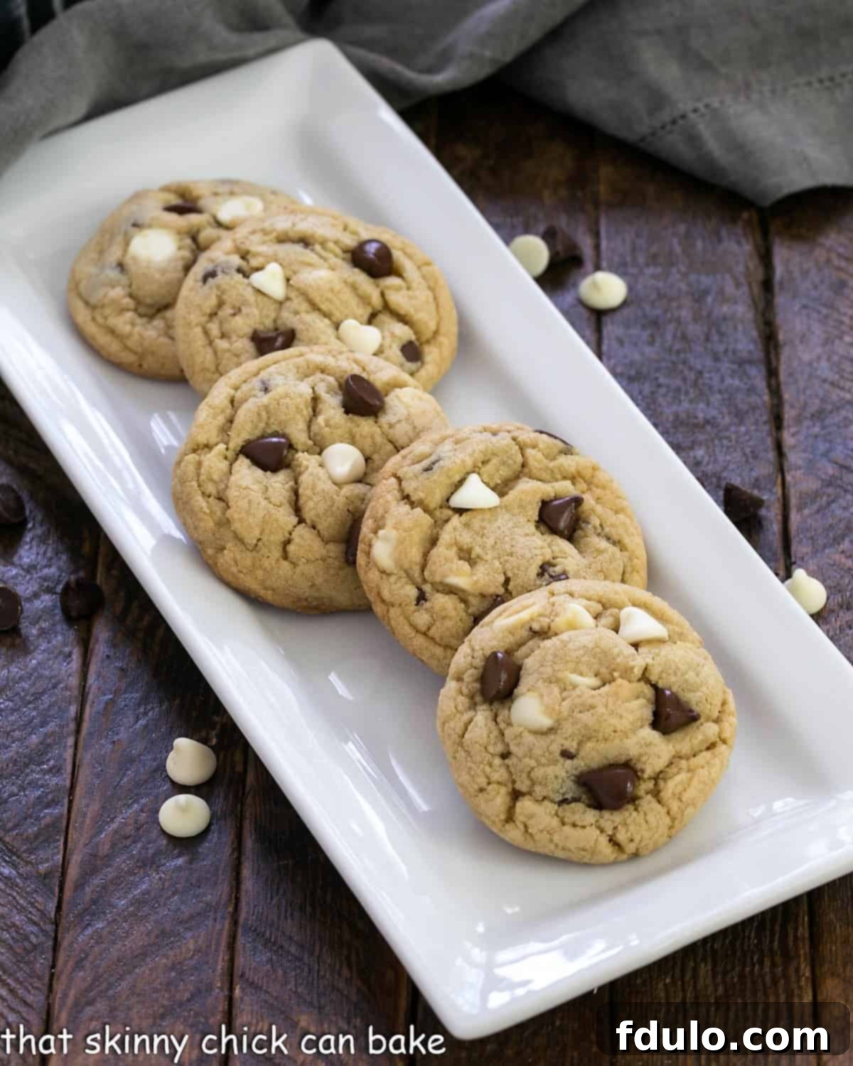 Soft chocolate chip pudding cookies arranged beautifully on a white ceramic tray, highlighting their delightful texture and golden-brown appearance.