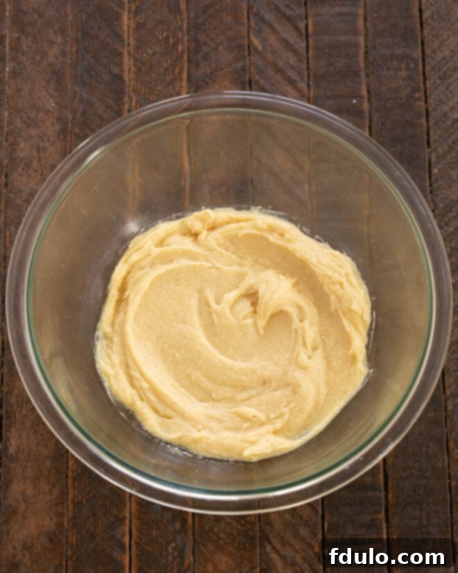 Chocolate Chip Oreo Brownies 7 Vanilla and eggs are beaten into the butter and sugar mixture for the cookie dough.