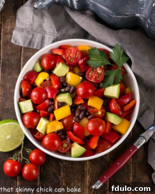 Chunky Guacamole Salad - all the fabulous flavors of guacamole in a refreshing avocado salad dressed with a lime vinaigrette.! Overhead view of Guacamole Salad or Avocado Salad in a white serving bowl.