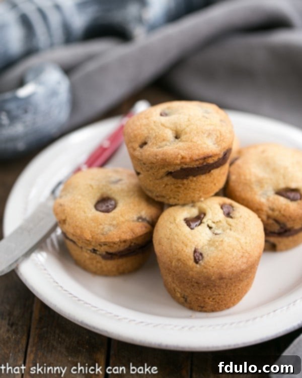 Delicious Chocolate Chip Lava Cookies artfully arranged on a white plate next to a red-handled knife, highlighting their irresistible appeal.