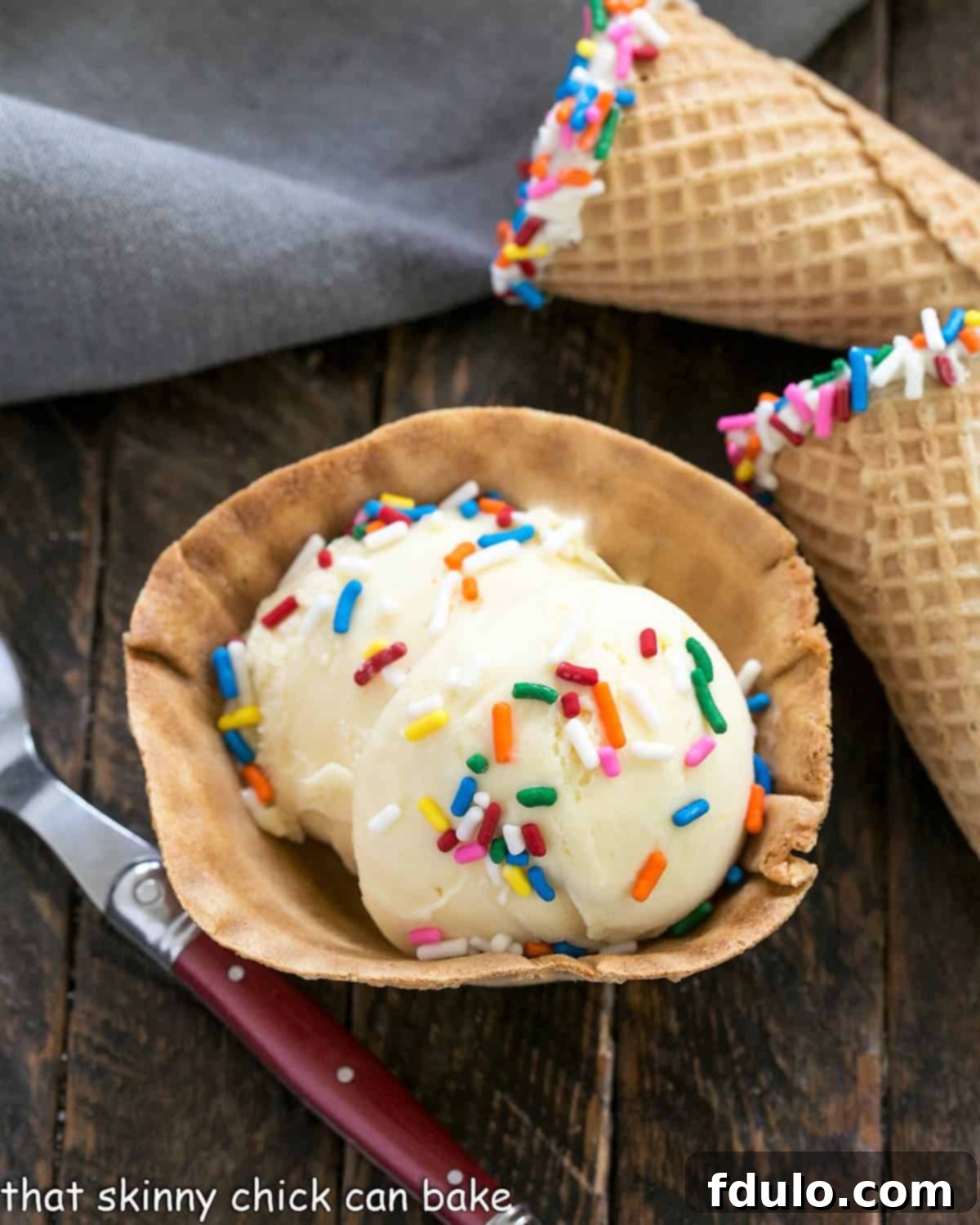 A trio of delicious cake batter ice cream cones, two adorned with colorful sprinkles and one served in a decorative sugar cone dish, showcasing their festive appeal.