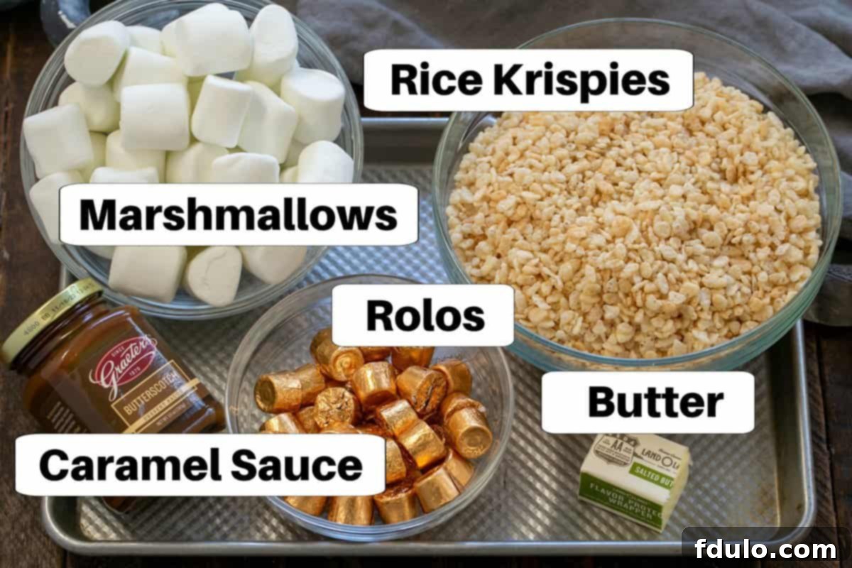 Gooey Rolo Caramel Krispie Treats 3 Labeled ingredients for caramel rolo rice krispie treats laid out on a sheet pan.