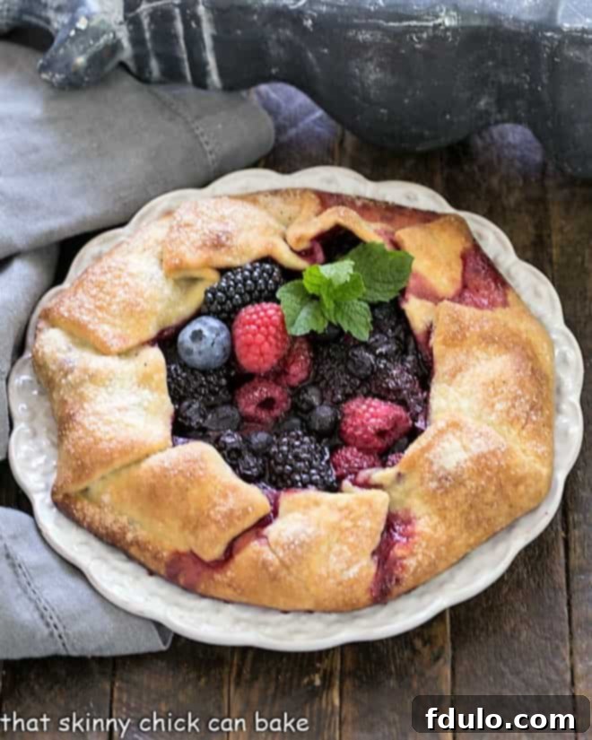 Overhead view of Mixed Berry Galette on a white serving plate.