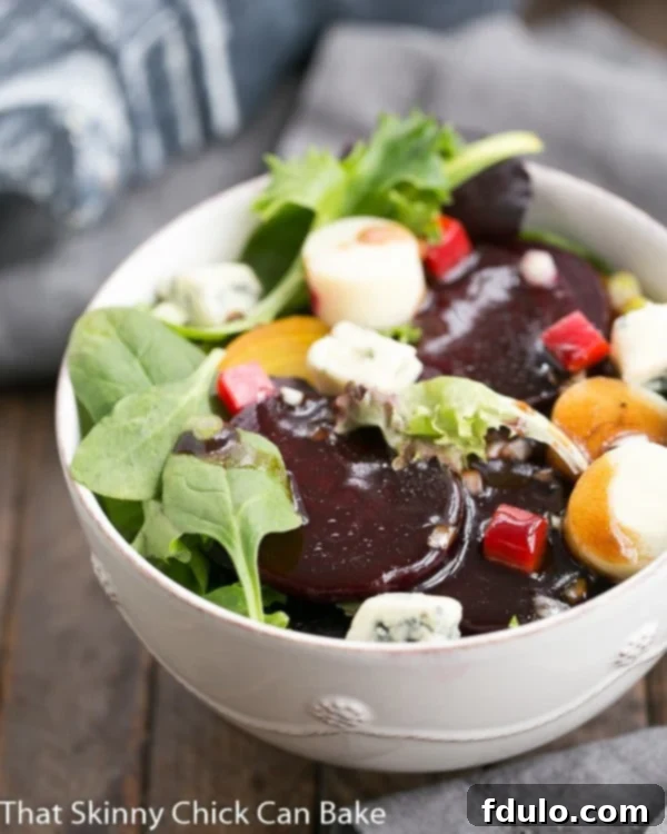 Exquisite Roasted Beet Salad with Blue Cheese and Hearts of Palm - A Gourmet Delight! A vibrant Beet Salad with Blue Cheese and Hearts of Palm, served in a pristine white salad bowl, showcasing its rich colors and textures.