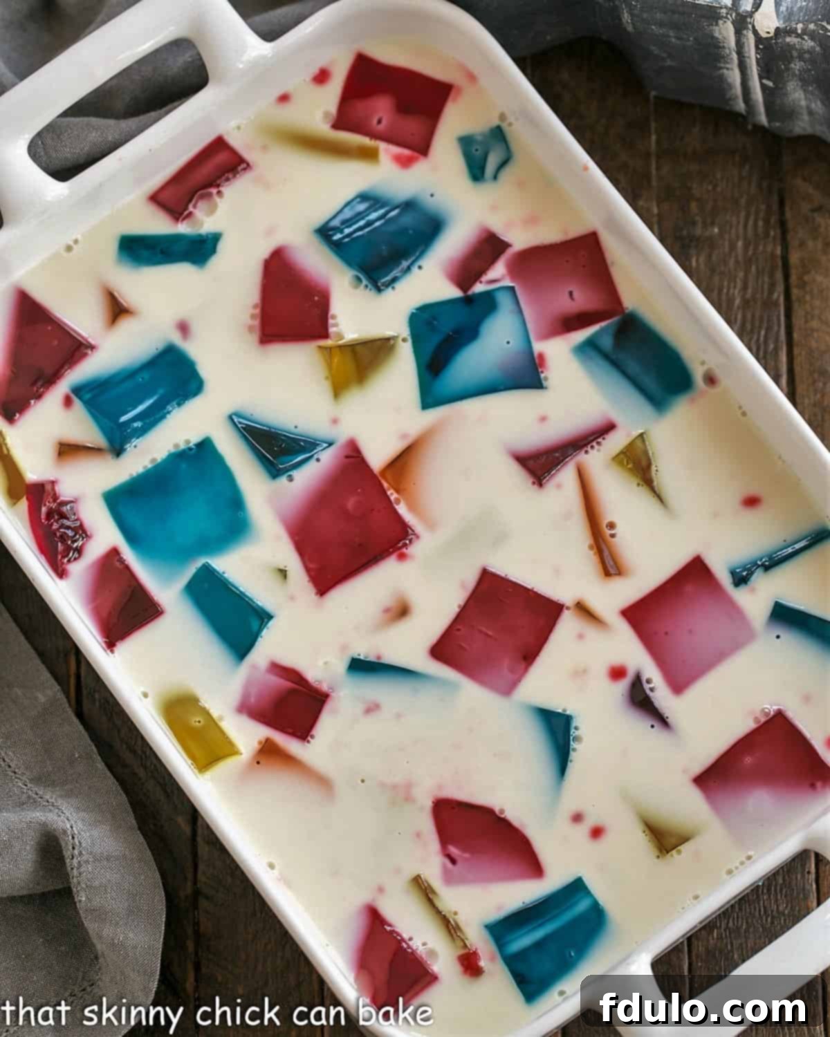 Stained Glass Dessert 4 An overhead view of the completed Stained Glass Jello in a white casserole dish, showing the vibrant color medley.