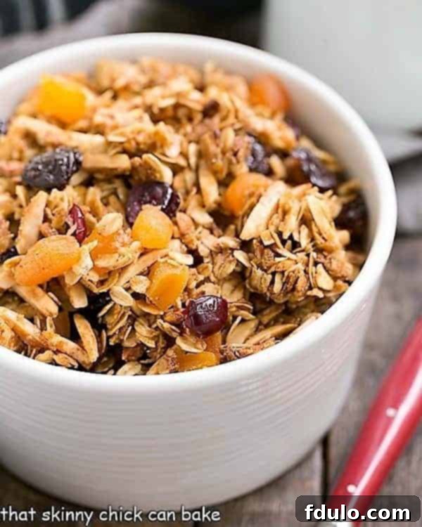Homemade Vanilla Granola with Dried Fruit - A perfect breakfast treat with oats, almonds, and a touch of vanilla! Vanilla Granola with dried fruit in a cereal bowl, ready to be enjoyed.
