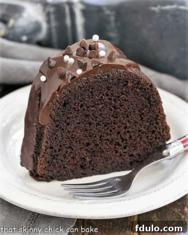 Slice of Chocolate Sour Cream Bundt Cake on a white plate