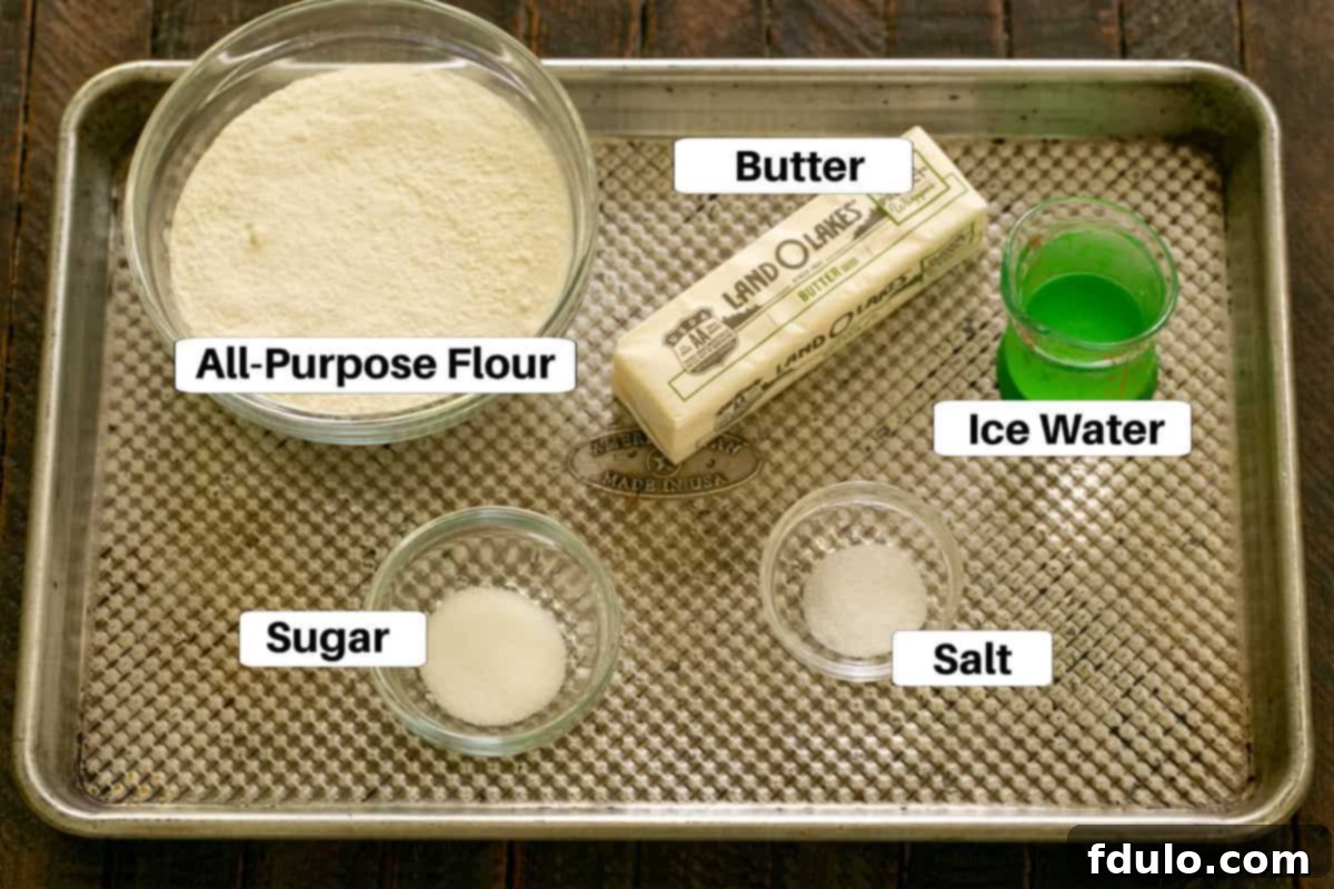 Peach Galette Crust Ingredients on a Sheetpan with labels, including flour, butter, sugar, and salt.