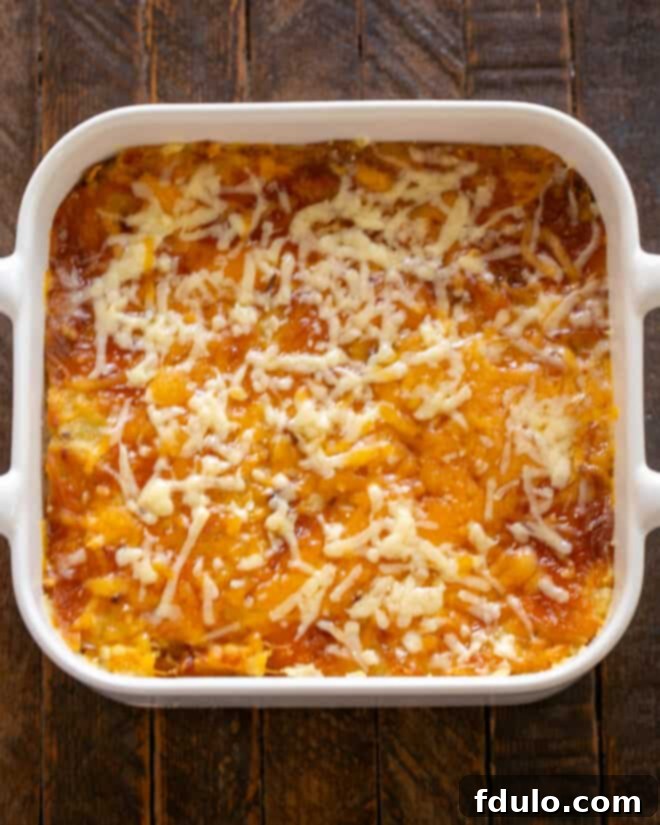 Overhead view of a beautifully baked twice baked potato casserole, golden and bubbly.