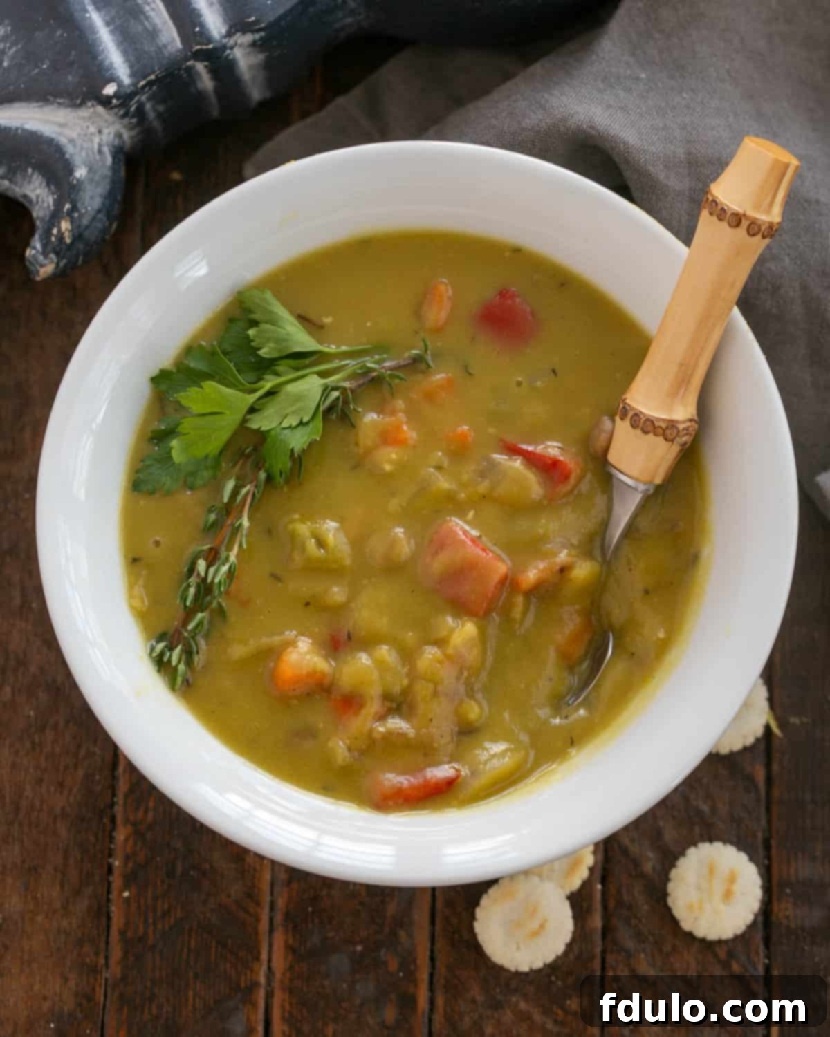 Finished Split Pea and Ham Soup simmering gently in a pot before serving.