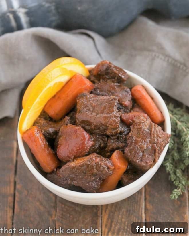 Overhead view Beef Stew with red wine in a white bowl.