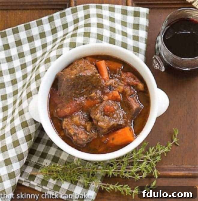Overhead view of Slow Cooked Beef Stew with Red Wine, Carrots and Tomatoes.