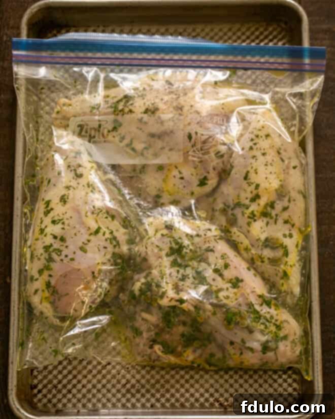 Chicken piccata marinating in a sealed ziploc bag.
