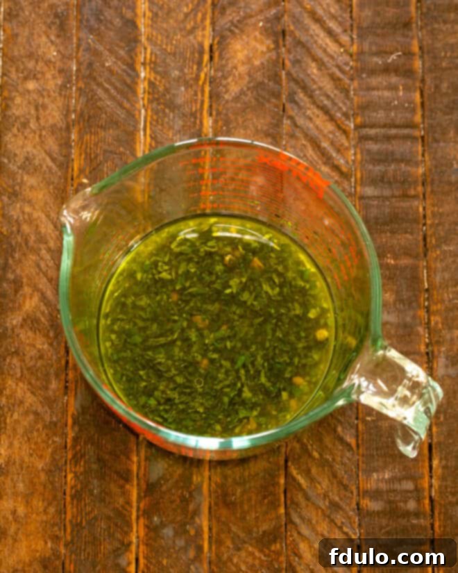 Reserved marinade with freshly chopped parsley and capers added.