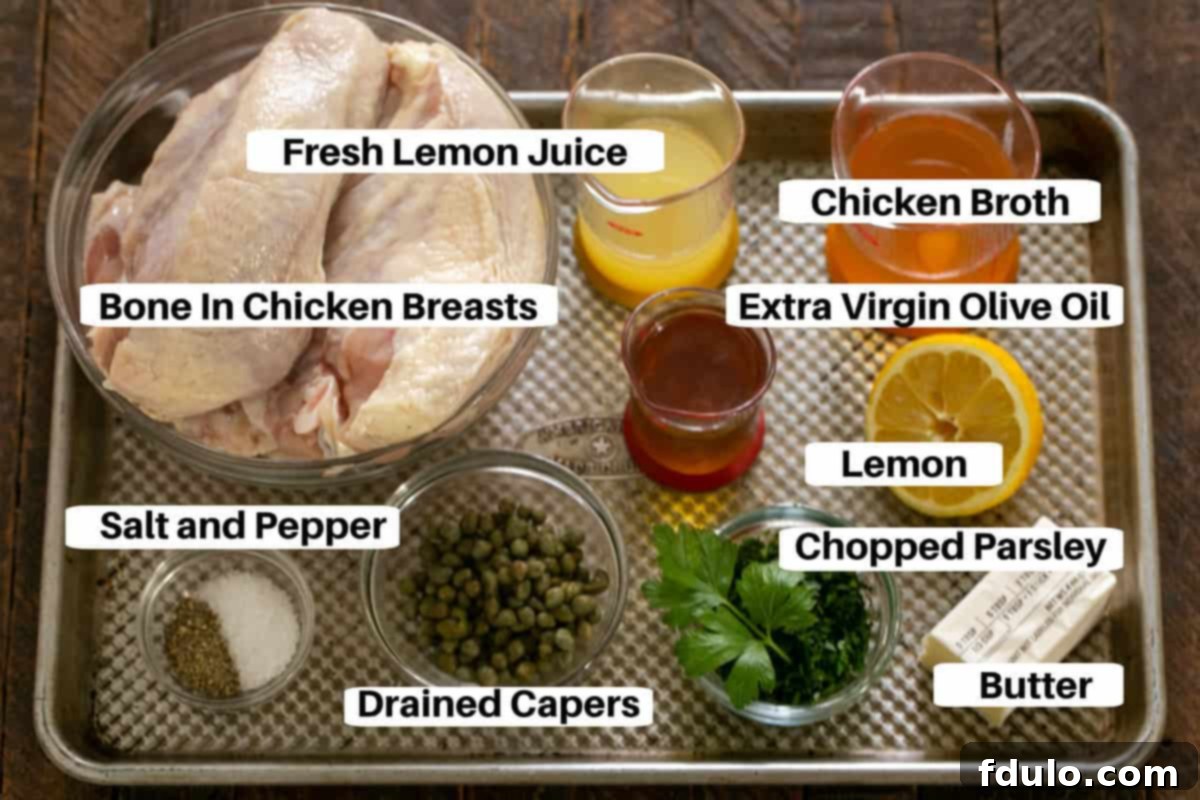 Arrangement of Grilled Chicken Piccata Ingredients with labels on a metal sheet pan.