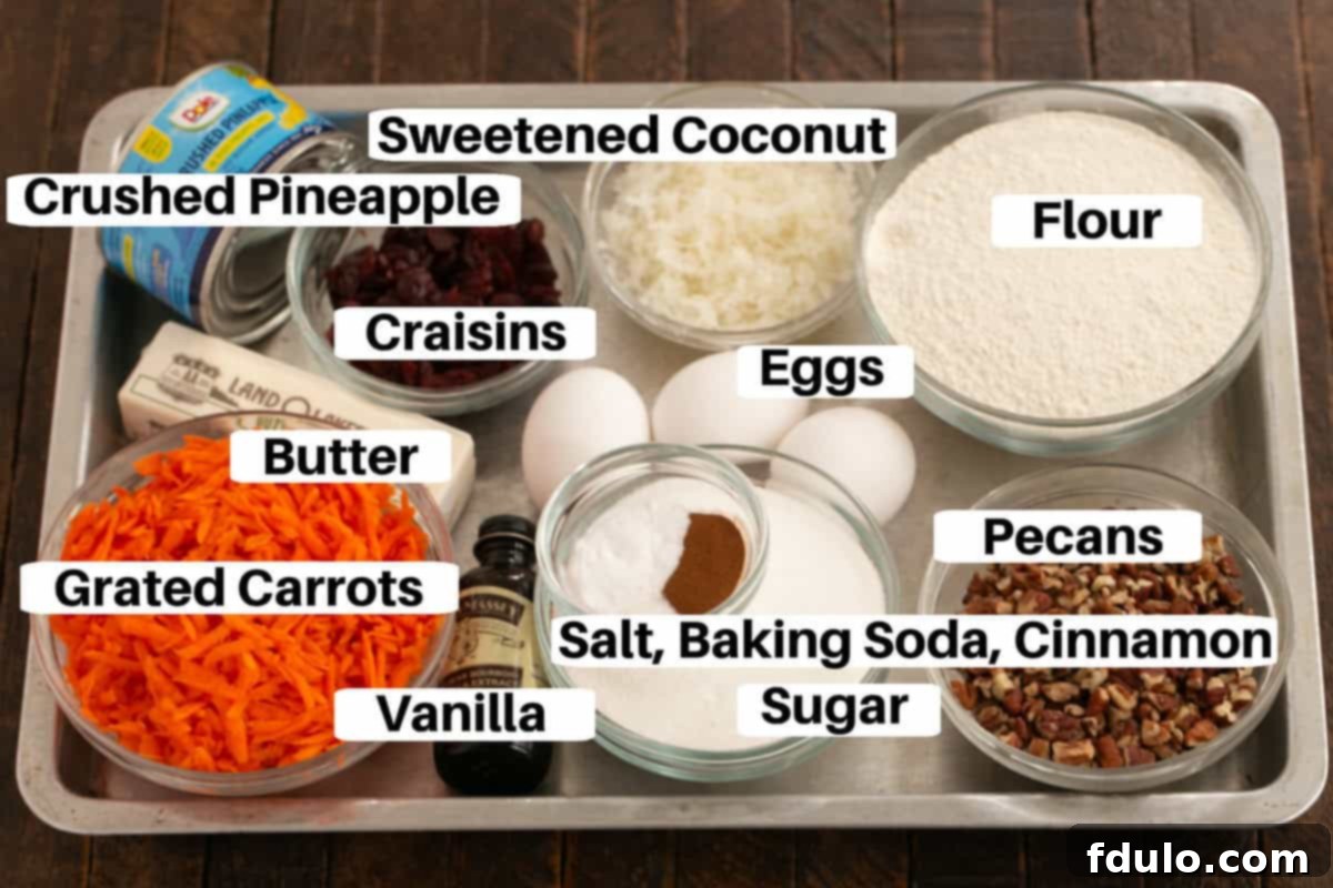 Morning glory muffin ingredients on a sheet pan with labels.