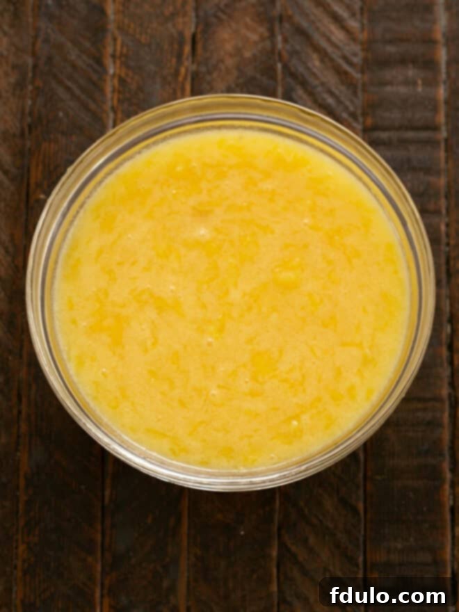 Add sugar, melted butter and vanilla.