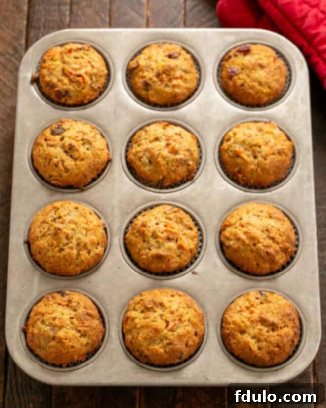 Scoop about a third of a cup of batter into muffin tin with muffin papers.