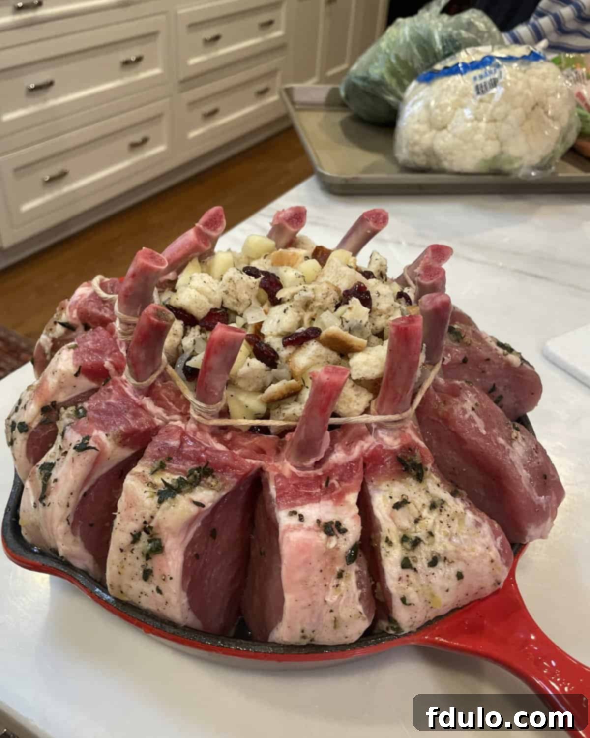 Crown Pork Roast with Apple Pecan Stuffing ready for the oven.
