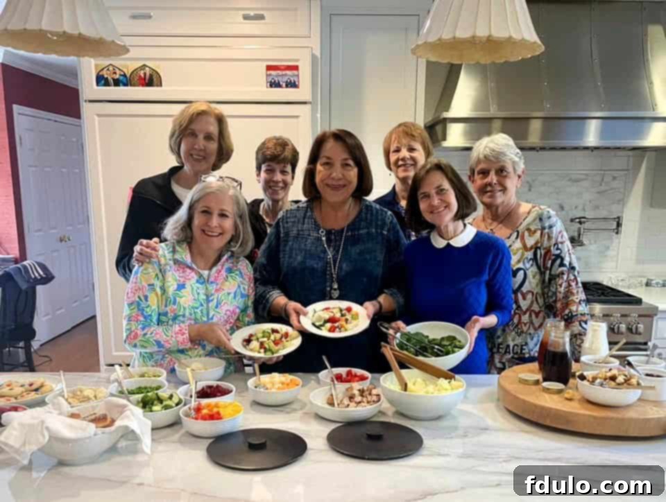 Guests enjoying a home salad bar at a book club meeting.