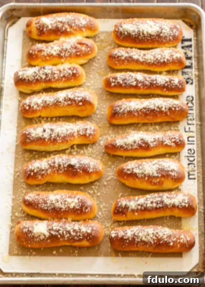 Melted butter and garlic salt being whisked together in a small bowl.