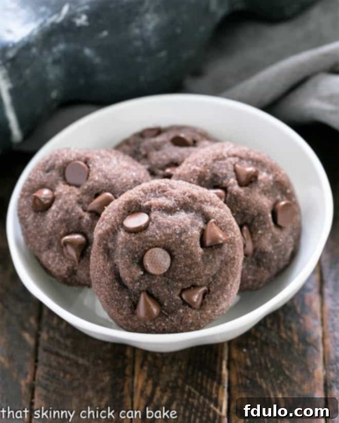 A white bowl with 4 Peanut Butter Filled Chocolate Cookies, showcasing their rich chocolate exterior and hint of peanut butter filling