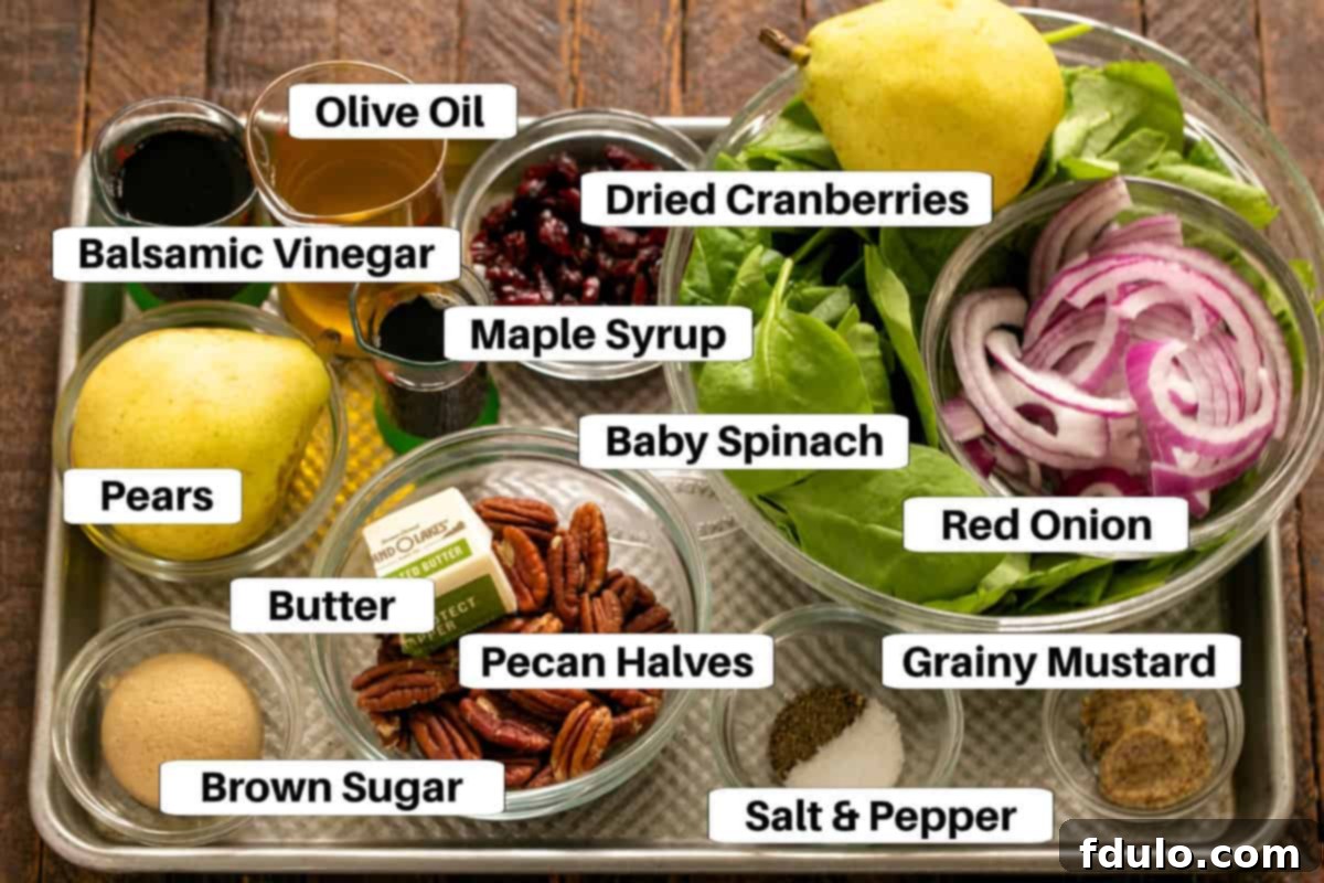 Spinach Salad with pears ingredients with labels on a metal sheet pan.