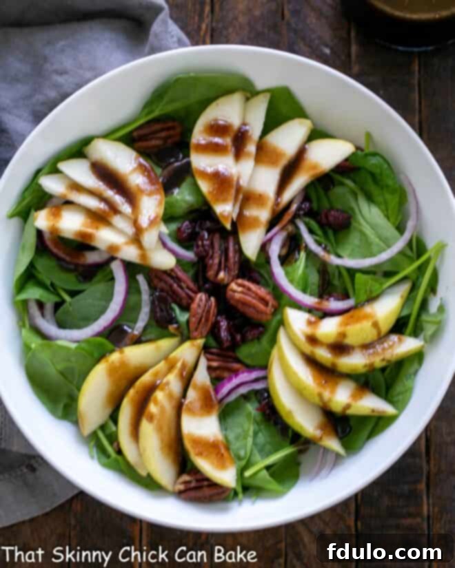 Overhead view of a Fall Salad in a round white bowl.