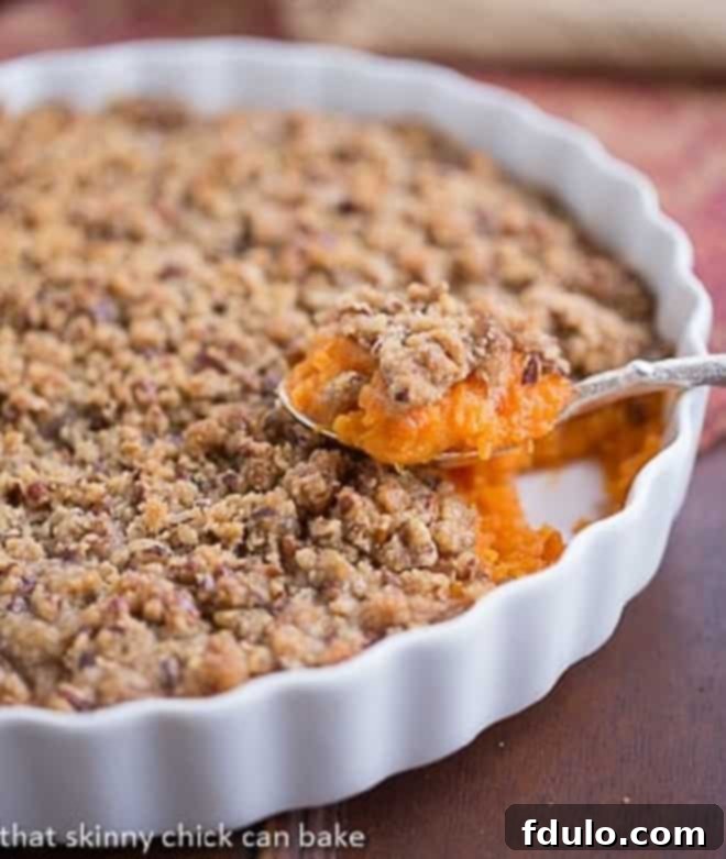 Praline Topped Sweet Potato Casserole - A perfect Thanksgiving side dish, guaranteed to win over even sweet potato skeptics with its delicious praline topping.
