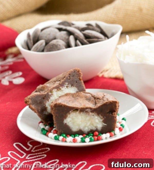 A beautifully presented close-up of Mounds Brownie Cupcakes, inviting you to take a bite and discover the coconut surprise within.