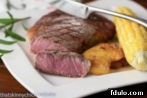 Close-up of a perfectly grilled ribeye steak with grill marks