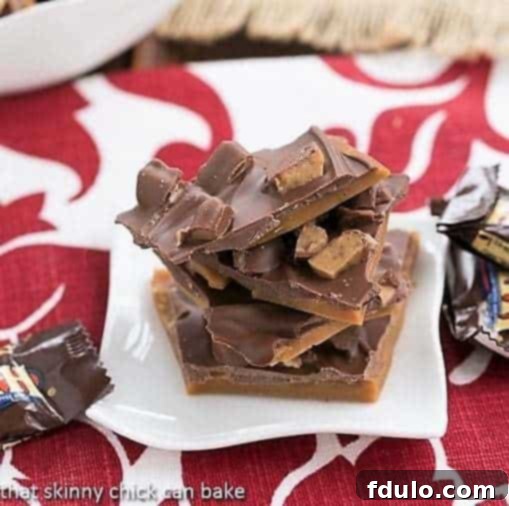 Double Dose English Toffee pieces on a small white plate, ready to be enjoyed.