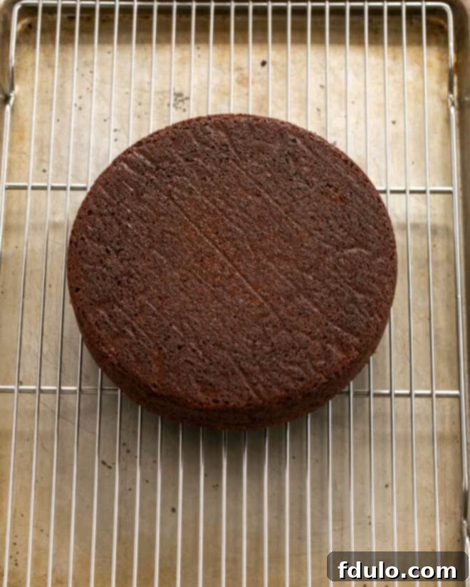 Step 10: Removing the cake from the pan after cooling slightly.