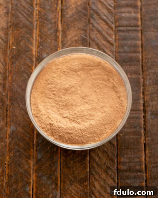 Step 2: Whisking dry ingredients together in a bowl.