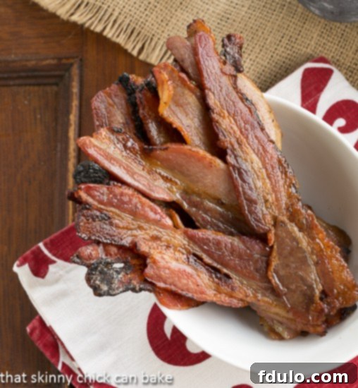 Candied Bacon AKA Pig Candy in a bowl viewed from above, highlighting its glossy, caramelized surface.