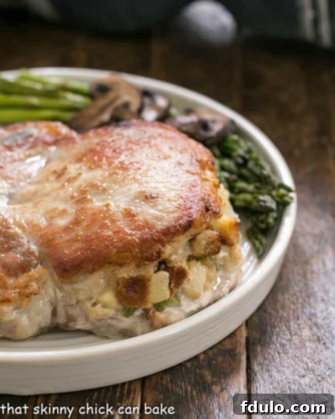 Another close-up of a succulent Stuffed Pork Chop, showcasing the delicious apple and thyme filling.