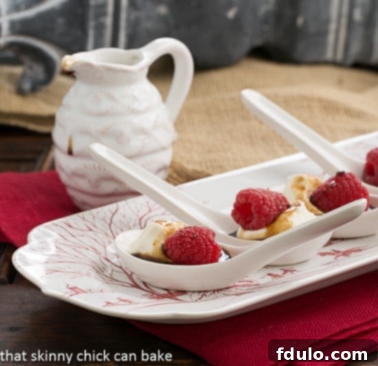 Balsamic Raspberries with Mascarpone Cream served in elegant Chinese soup spoons on a red and white tray