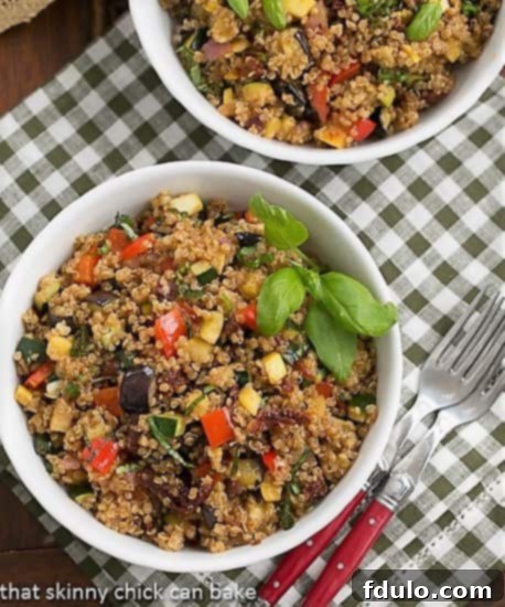 Overhead view of two aesthetically pleasing bowls of Quinoa Salad with Roasted Vegetables, showcasing its fresh ingredients and vibrant colors.