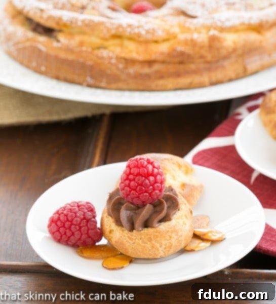 Paris-Brest Cake - a cream puff made from leftover batter filled with chocolate pastry cream and topped with a raspberry