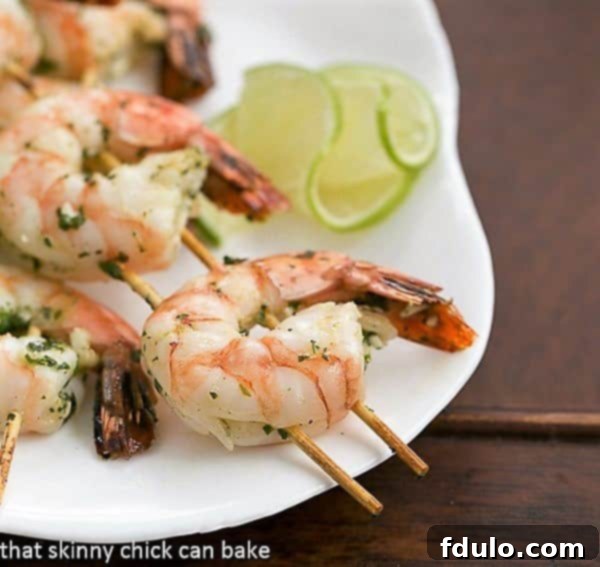 Close view of Grilled Margarita Shrimp on two parallel skewers