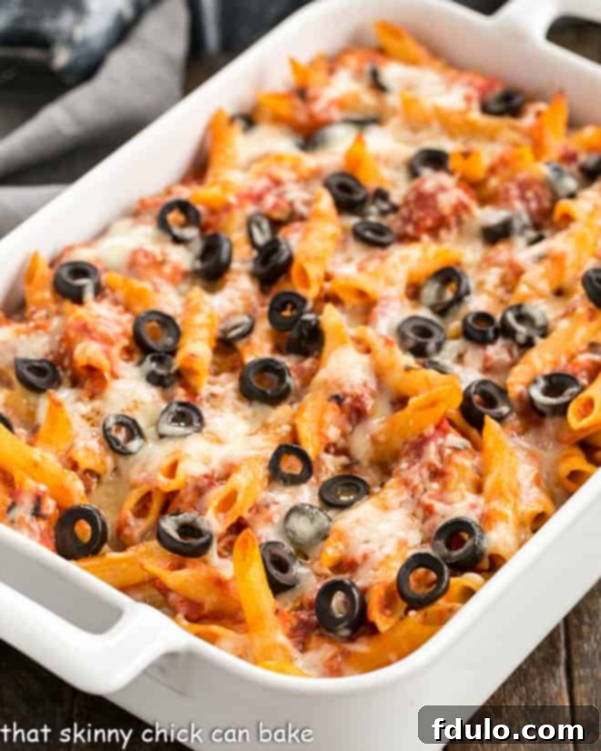 Overhead view of Pasta Bake with Tomatoes and Havarti in white casserole dish.