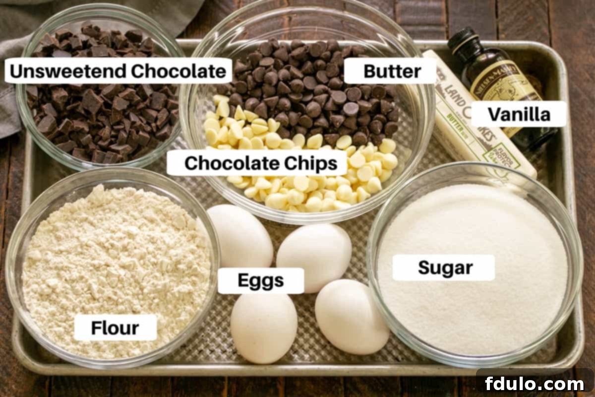 Brownie cookie ingredients with labels on a metal sheet pan, ready for baking.