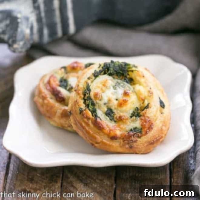 Greek Spanikopita-inspired puff pastry pinwheels.