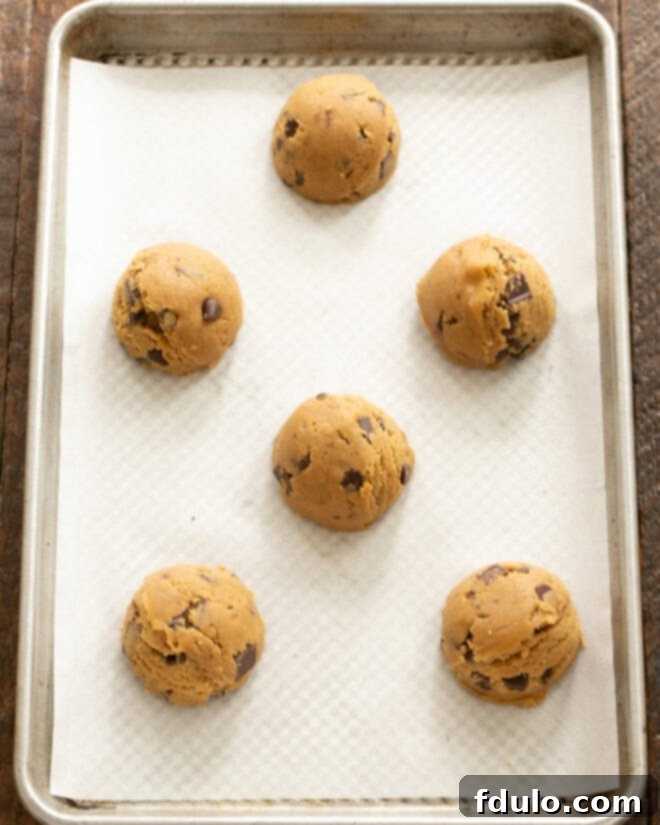 Colossal Chocolate Chip Cookies 9 Scoop large dough balls onto a prepared baking sheet.